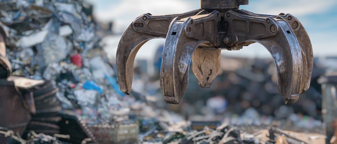 Close up View On Mechanical Arm Claw Of Crane At Landfill.